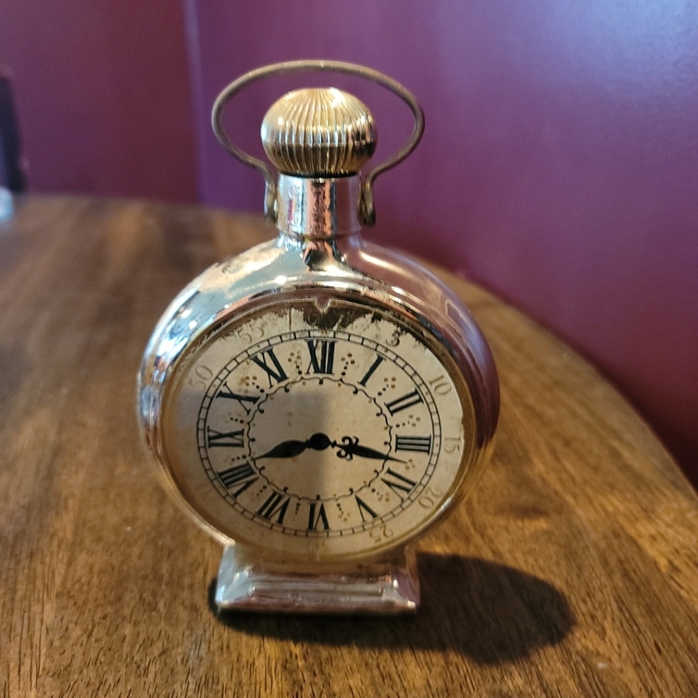 !Pocket watch avon bottle. Please refer to pictures